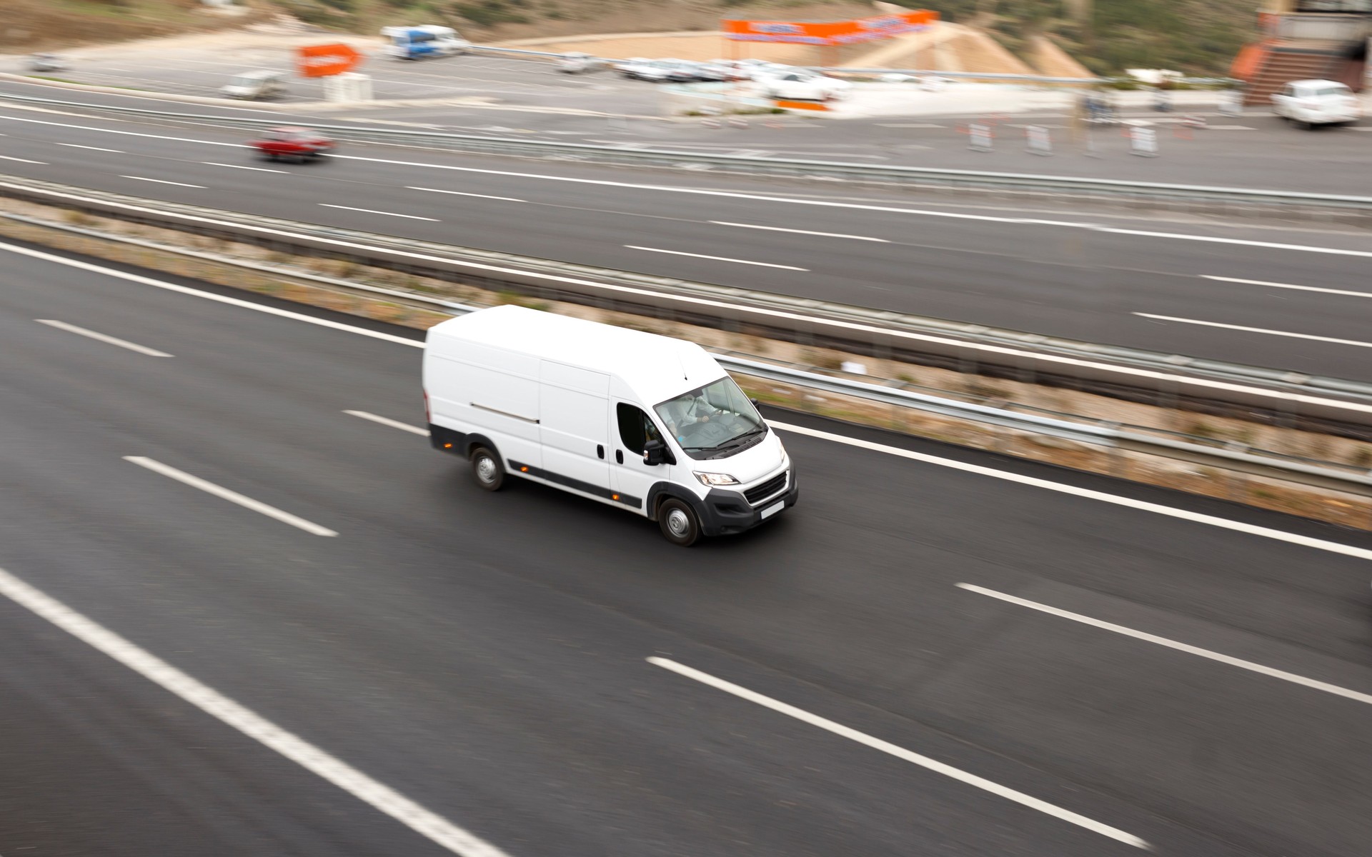 White Delivery Van On Highway