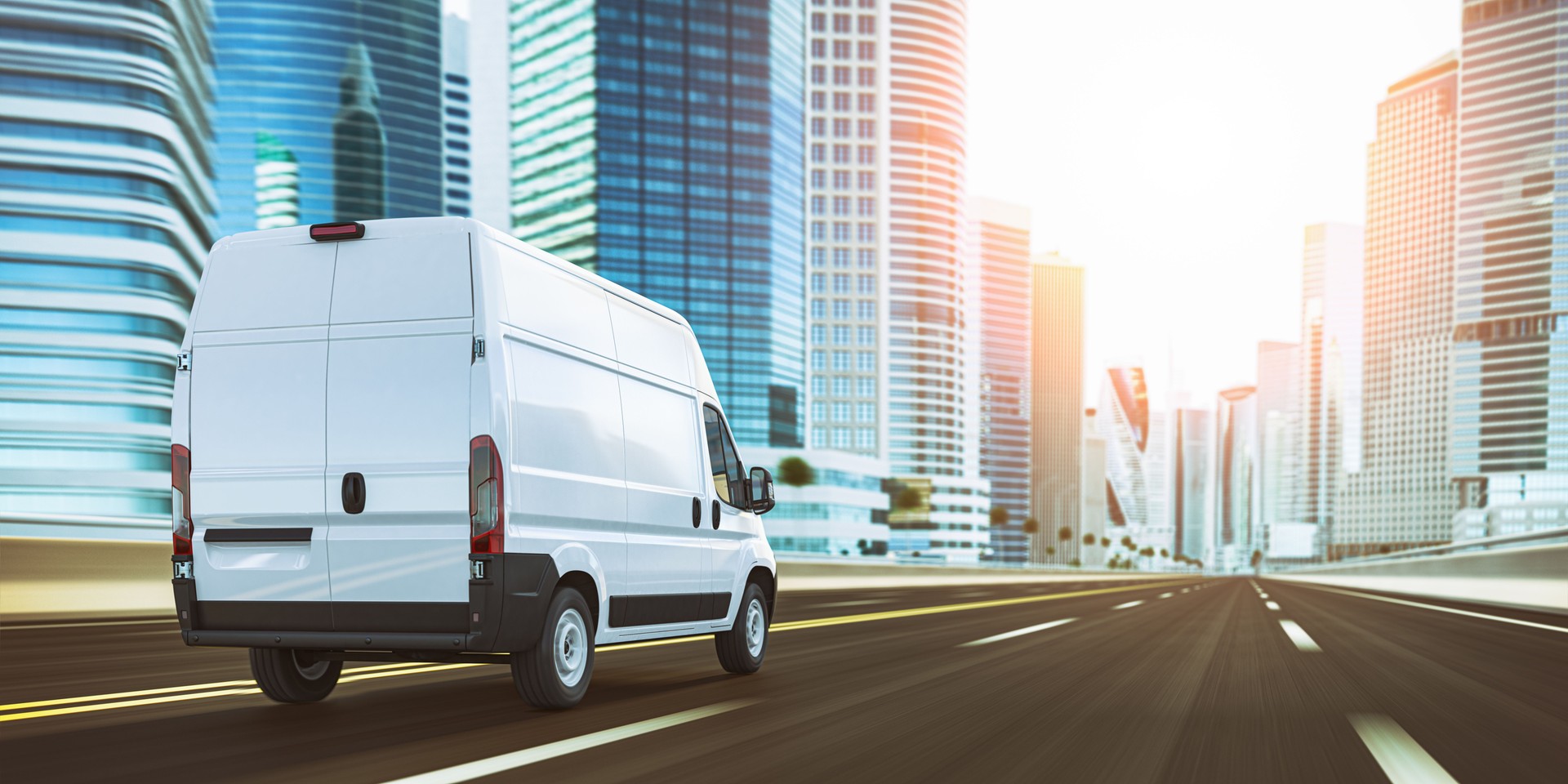 Van moving on highway in the city with skyscrapers. Fast express delivery concept.